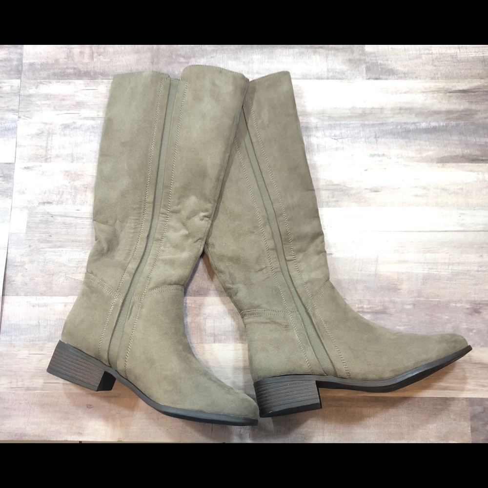 Calf high, low heeled boots.